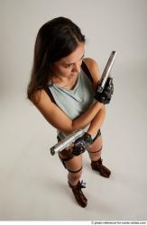 Woman Adult Average Fighting with gun Standing poses Casual Latino